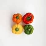 Four assorted-colored bell peppers