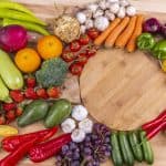 Fresh fruits and vegetables arranged on a board